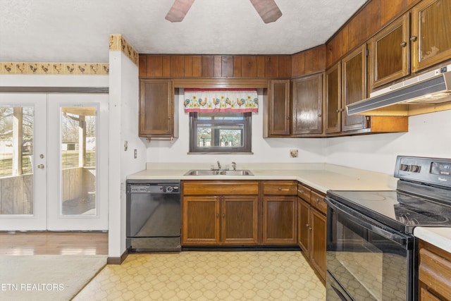 kitchen featuring french doors, sink, a textured ceiling, ceiling fan, and black appliances