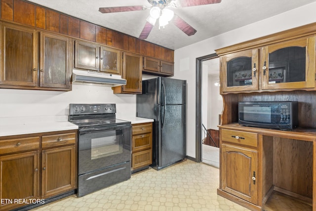 kitchen featuring a textured ceiling, ceiling fan, and black appliances