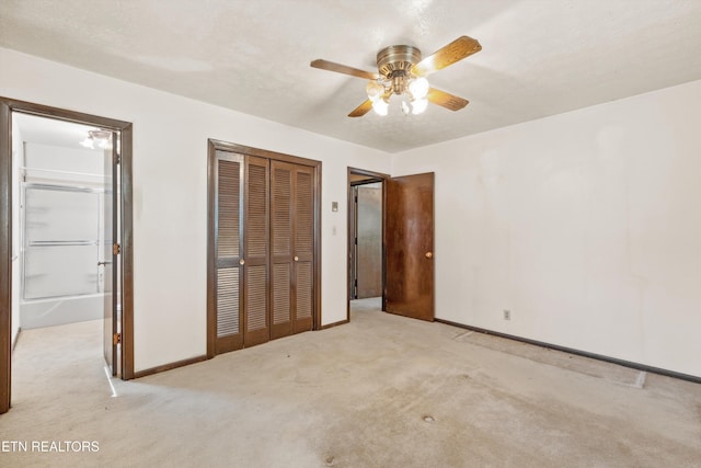 unfurnished bedroom featuring ceiling fan and light colored carpet