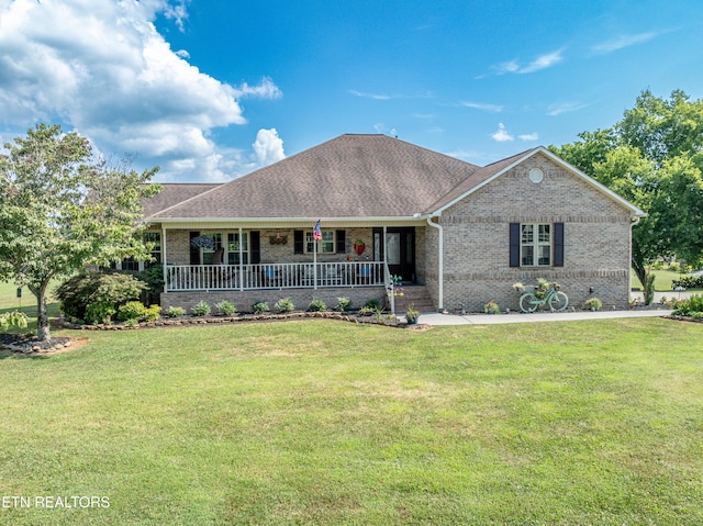 single story home featuring a porch and a front yard