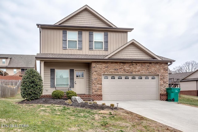 view of front of property featuring a garage and a front lawn