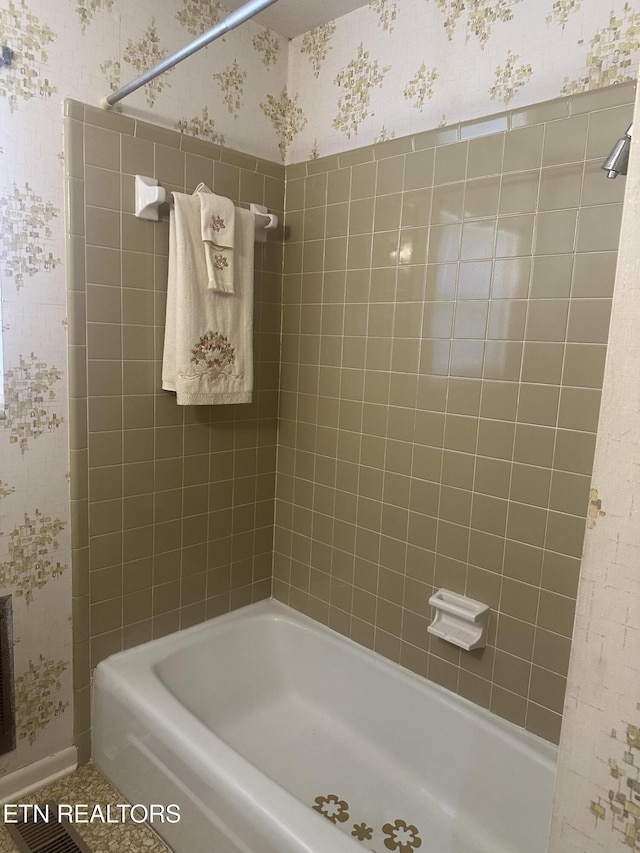 bathroom with tub / shower combination and tile patterned floors