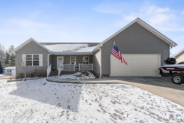 single story home with a garage and covered porch