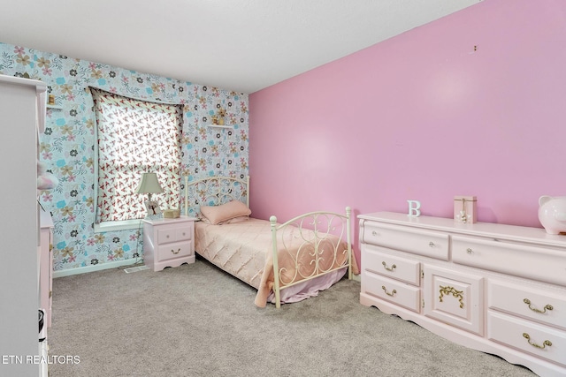 bedroom featuring light colored carpet