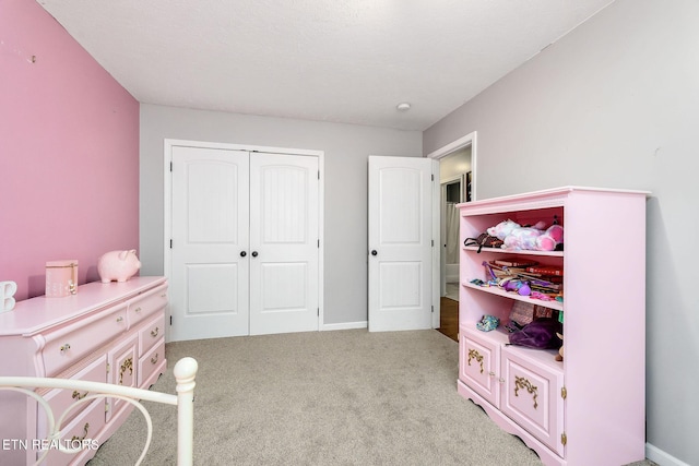 carpeted bedroom with a closet