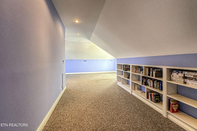 hallway featuring lofted ceiling, recessed lighting, carpet, and baseboards