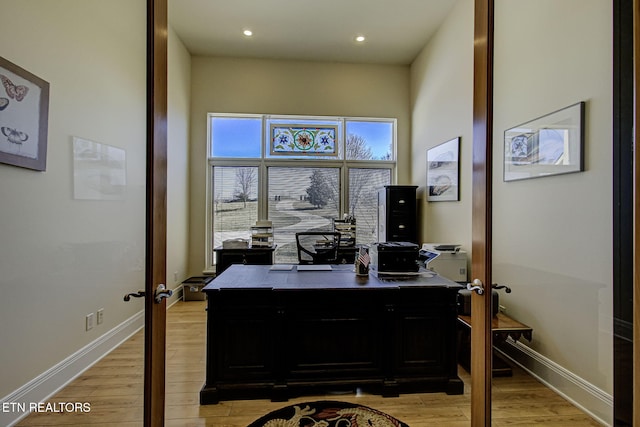 office featuring light wood-style floors, baseboards, and recessed lighting