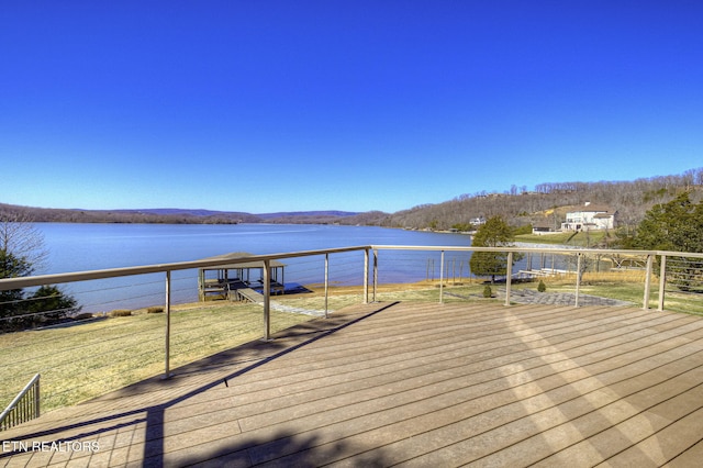 wooden deck with a water view