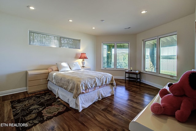 bedroom featuring recessed lighting, visible vents, dark wood finished floors, and baseboards