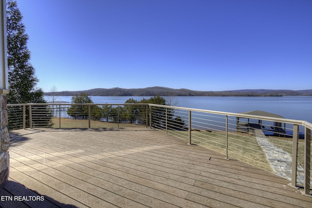 deck featuring a water view