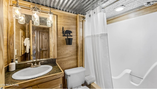 bathroom with vanity, a shower with curtain, and toilet