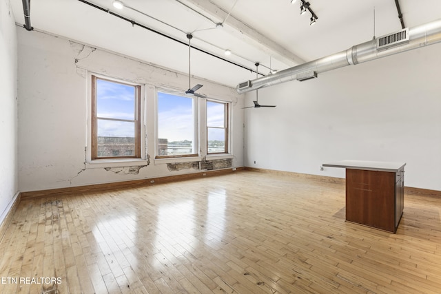 spare room with light hardwood / wood-style flooring