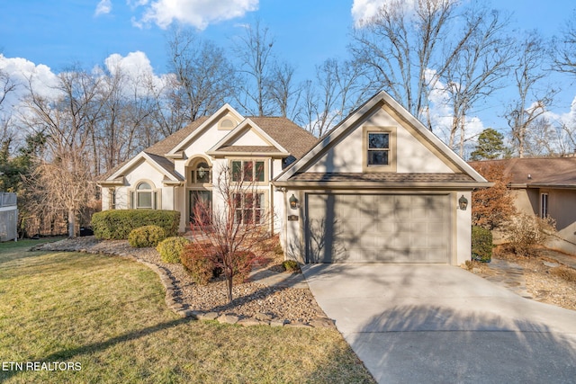 view of front of home featuring a garage and a front lawn