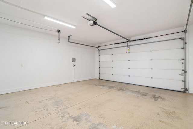 garage featuring a garage door opener