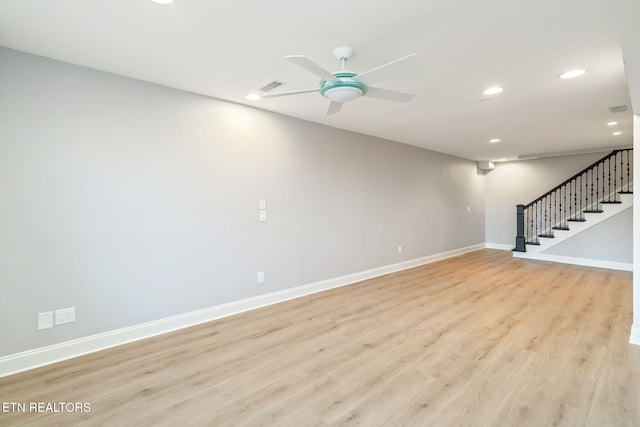 unfurnished living room featuring light hardwood / wood-style flooring and ceiling fan