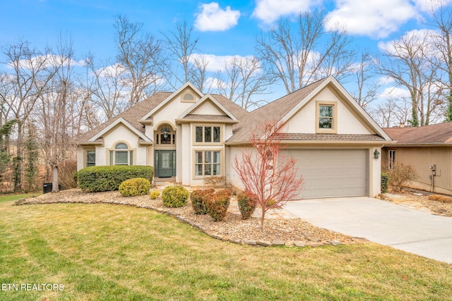 view of front of property featuring a garage and a front lawn