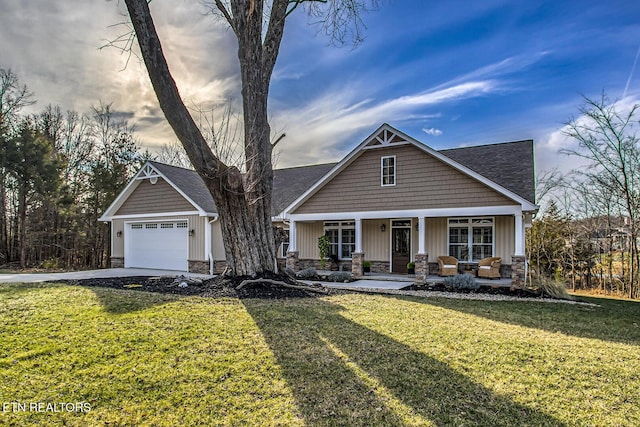 craftsman inspired home featuring a porch, a garage, and a front lawn