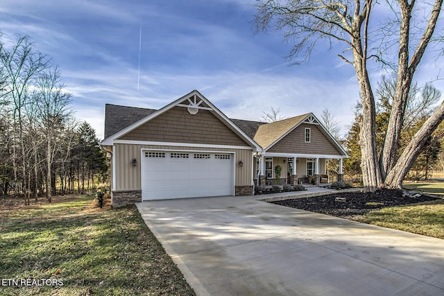 craftsman inspired home with a garage, a front lawn, and a porch