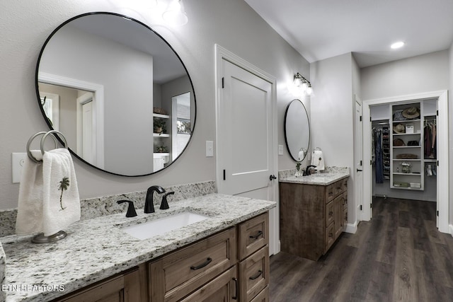 bathroom featuring vanity and wood-type flooring