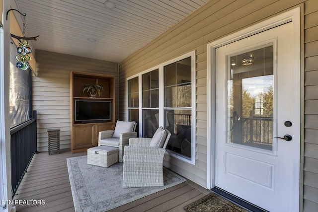 wooden terrace featuring a porch