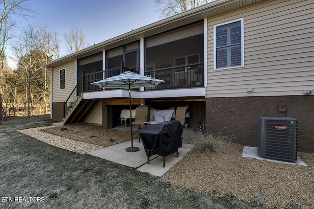 back of property featuring a patio and central air condition unit