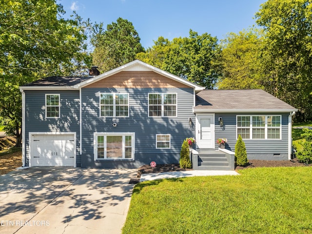 view of front of house with driveway, crawl space, a garage, and a front yard