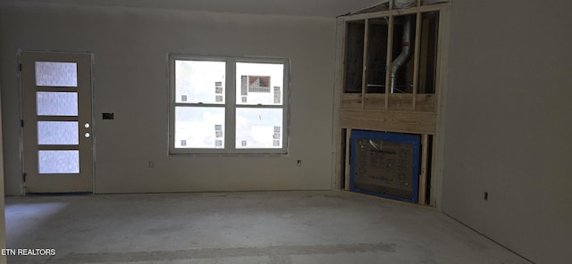 unfurnished living room with plenty of natural light