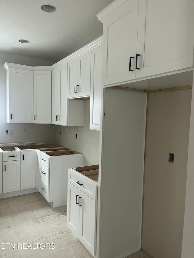 kitchen featuring white cabinetry