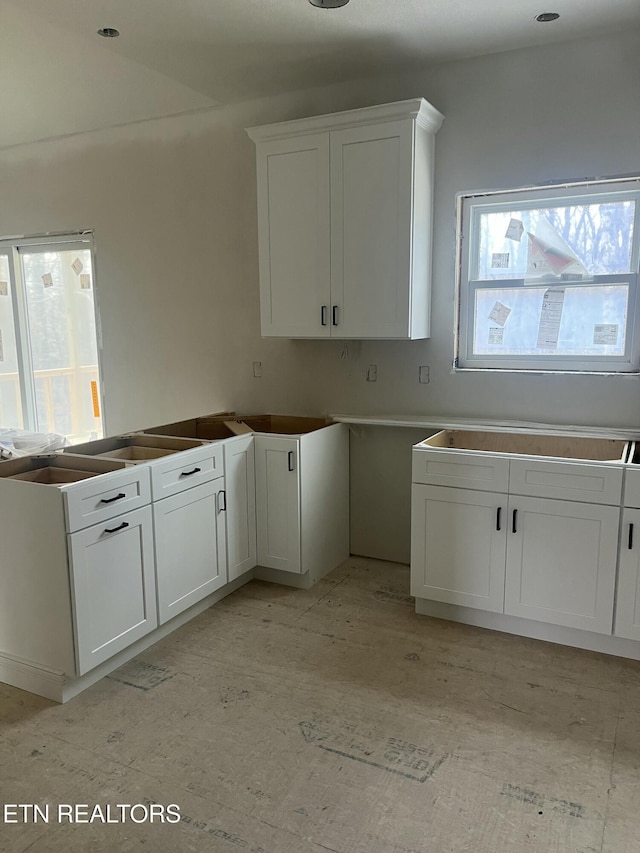 kitchen featuring white cabinets