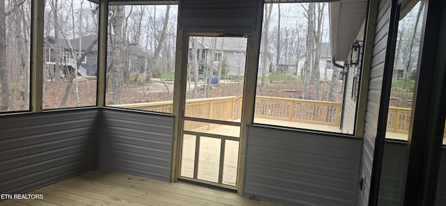 unfurnished sunroom with plenty of natural light
