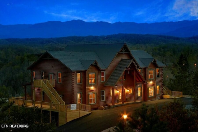 back of property with a mountain view