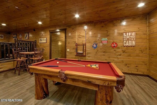 recreation room featuring hardwood / wood-style floors, wooden ceiling, and wood walls