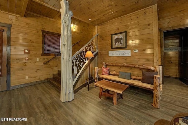 sitting room with wood ceiling, wood-type flooring, and wood walls