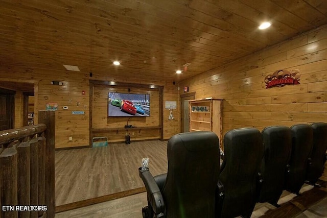 home theater with wood-type flooring, wooden ceiling, and wooden walls