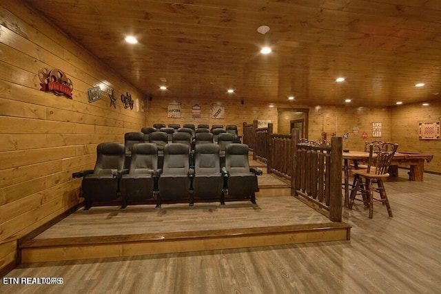 home theater with wood ceiling, hardwood / wood-style floors, and wood walls