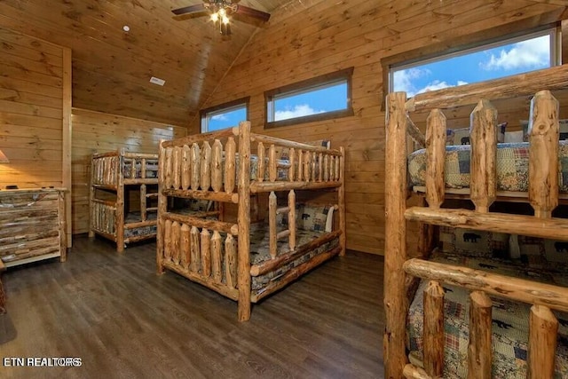 bedroom with wooden ceiling, lofted ceiling, dark hardwood / wood-style flooring, and wood walls