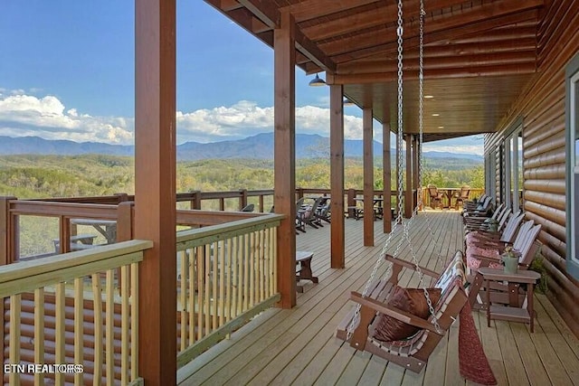 wooden deck featuring a mountain view