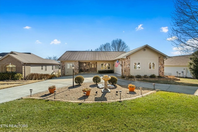 ranch-style house featuring a garage and a front lawn