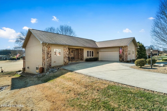 single story home featuring a garage and a front yard