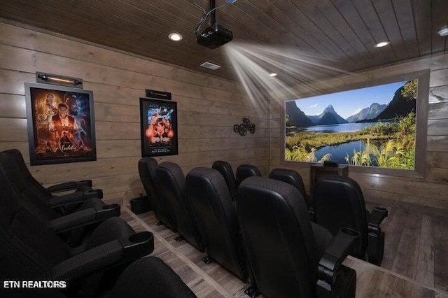 cinema featuring wooden walls and wood ceiling