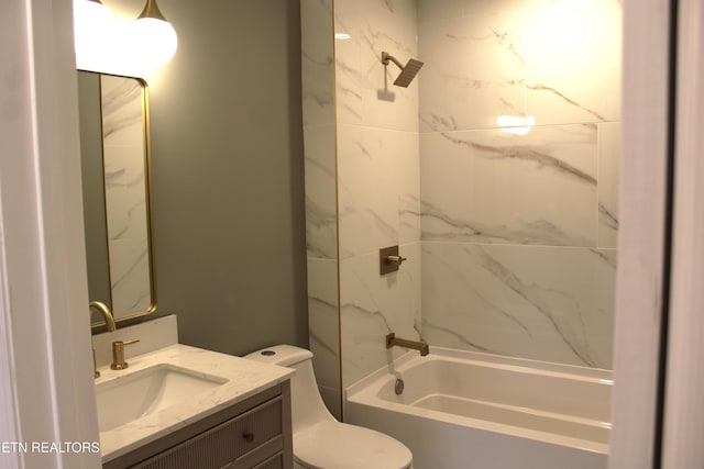 full bathroom featuring vanity, toilet, and tiled shower / bath