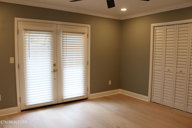 unfurnished bedroom with ornamental molding, ceiling fan, and light hardwood / wood-style flooring