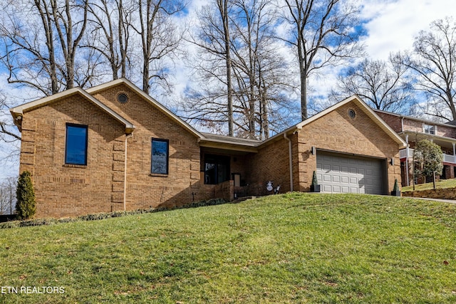 view of front of house with a garage and a front lawn