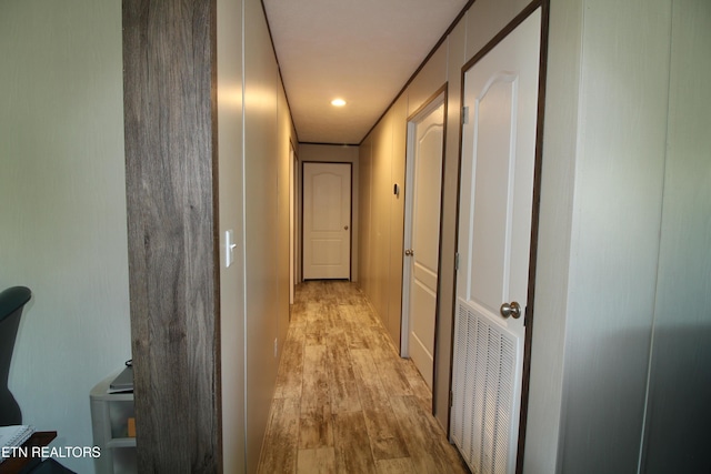 corridor featuring light hardwood / wood-style floors