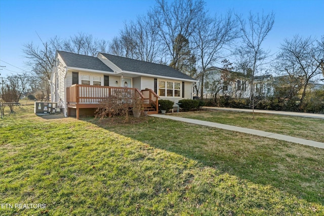 ranch-style home featuring a wooden deck and a front lawn