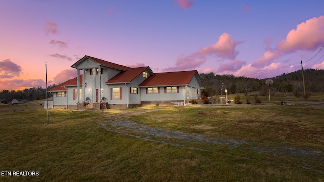 back of house featuring a garage, crawl space, and a yard