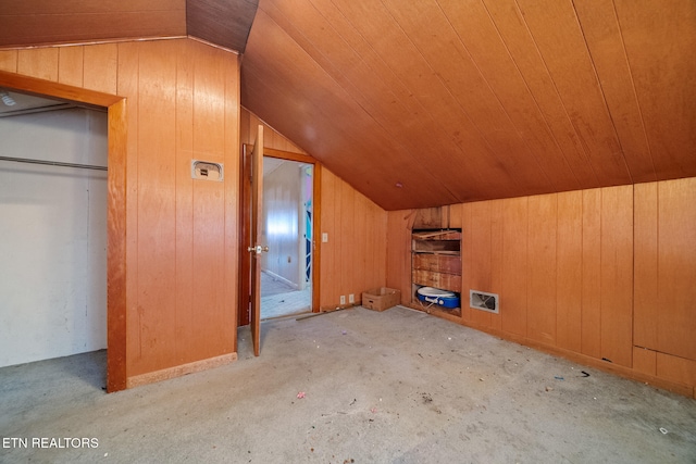 bonus room with wooden ceiling, wooden walls, and vaulted ceiling