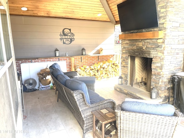 view of patio / terrace with a stone fireplace