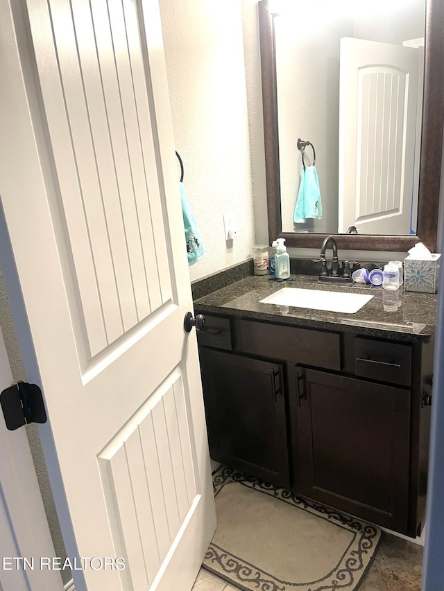 bathroom with vanity and tile patterned floors