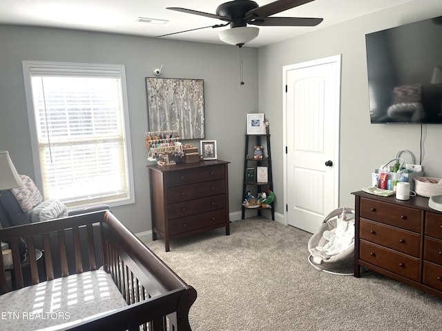 bedroom with light carpet and ceiling fan